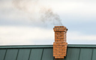 smoke-from-chimney-heating-smoke-billowing-coming-out-house-fire-prevention-chimney-against-blue-sky