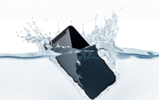 iphone submerged in large amount of water displaying water damage in electronics