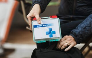 packing-first-aid-kit-into-emergency-evacuation-kit-for-home-fires