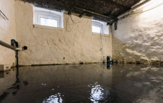 basement after floods and water damage take over and start rising