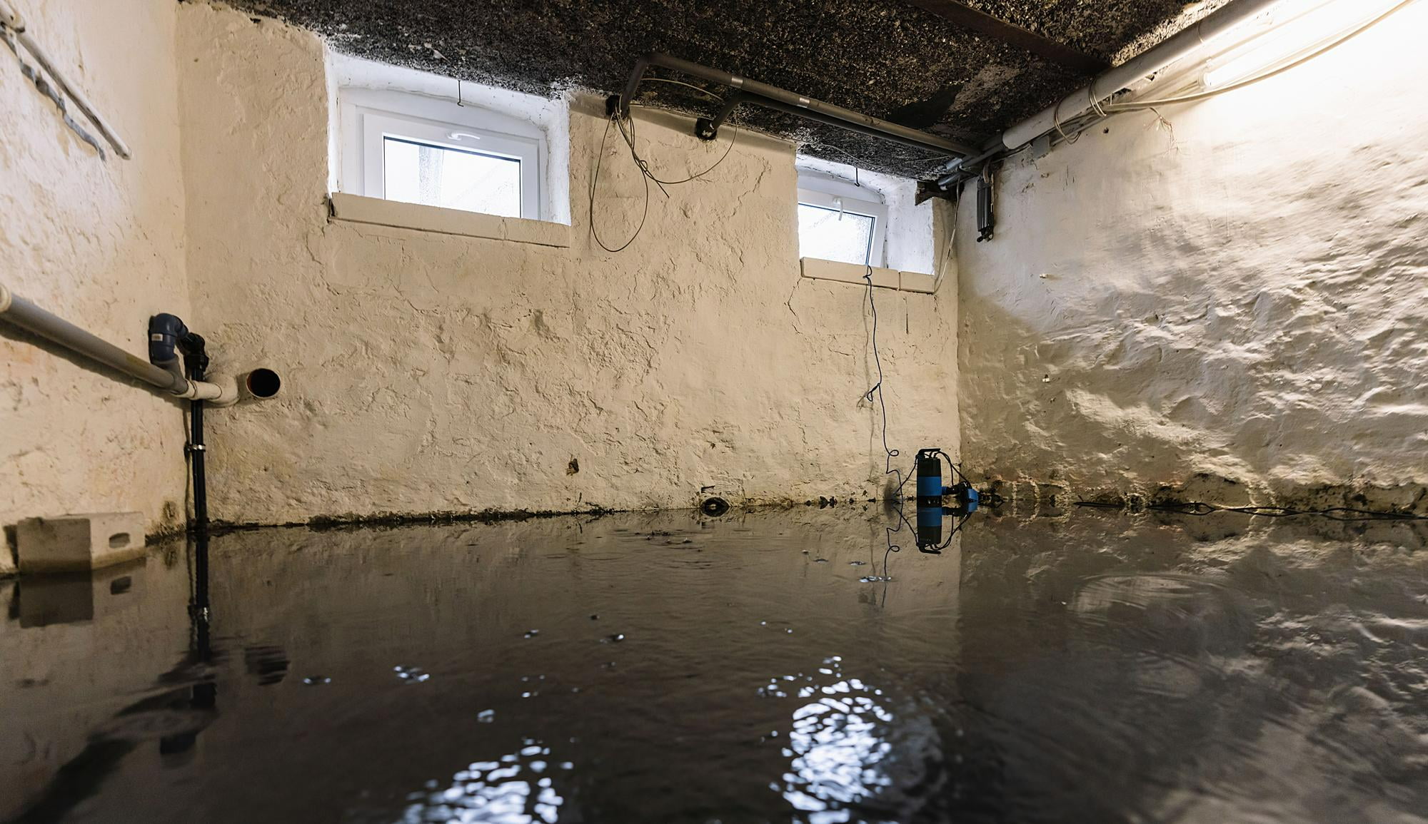 basement after floods and water damage take over and start rising