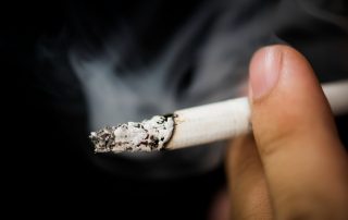 close-up-of-hand-holding-cigarette