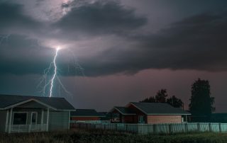 lightning strike above home during storm