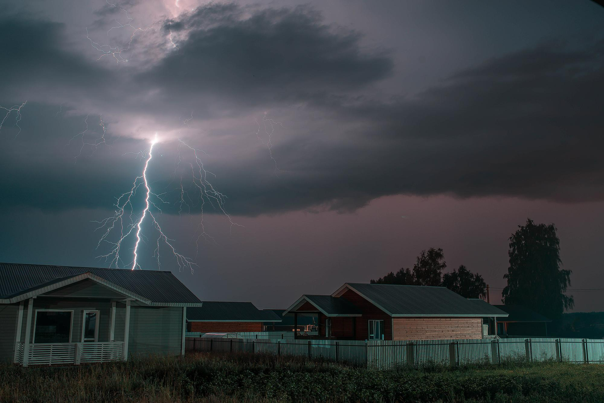 lightning strike above home during storm